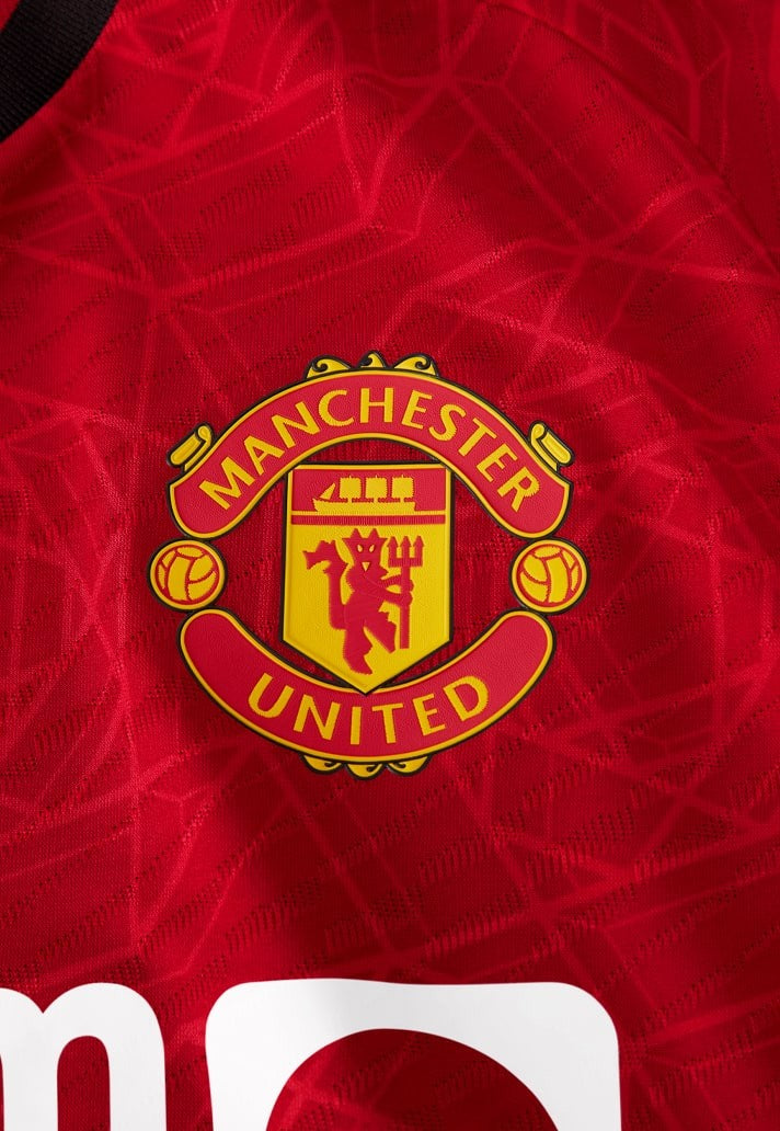 manchester united logo  on home shirt