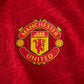 manchester united logo  on home shirt